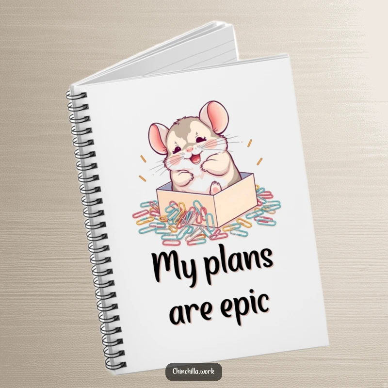 Funny Chinchilla Notebook featuring a chinchilla joyfully rolling in a pile of paperclips, encouraging creative thought.