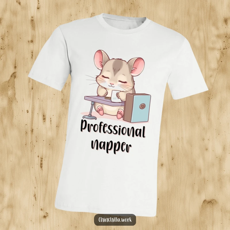 Funny chinchilla t-shirt, sleepy rodent at tiny desk, paperclip stuck to fur, relatable office fatigue and humor design.